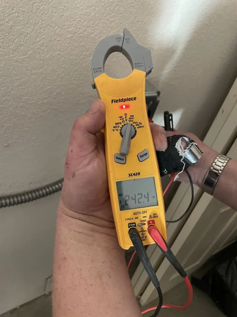 Voltage testing with clamp meter during Outlet Installation in Powell